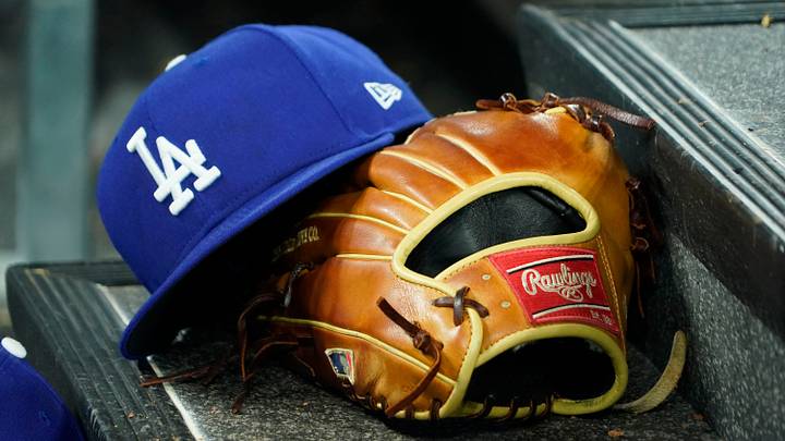 Apr 28, 2024; Toronto, Ontario, CAN; A hat and glove of an Los Angeles Dodgers player durng a game against the Toronto Blue Jays at Rogers Centre. Mandatory Credit: John E. Sokolowski-USA TODAY Sports Apr 28, 2024; Toronto, Ontario, CAN; A hat and glove of an Los Angeles Dodgers player durng a game against the Toronto Blue Jays at Rogers Centre. Mandatory Credit: John E. Sokolowski-USA TODAY Sports