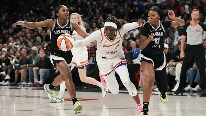 Oct 5, 2025; Las Vegas, Nevada, USA; Phoenix Mercury guard Kahleah Copper (2) drives the ball past Las Vegas Aces guards Jackie Young (0) and Dana Evans (11) during the second quarter of game two of the 2025 WNBA Finals at Michelob Ultra Arena. Mandatory Credit: Lucas Peltier-Imagn Images