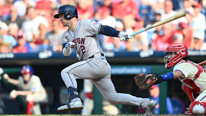 Aug 28, 2024; Philadelphia, Pennsylvania, USA; Houston Astros infielder Alex Bregman (2) hits a single against the Philadelphia Phillies in the third inning at Citizens Bank Park.
