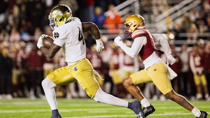 Nov 1, 2025; Chestnut Hill, Massachusetts, USA; Notre Dame Fighting Irish running back Jeremiyah Love (4) runs with the ball to score a 94 yard touchdown in the fourth quarter against the Boston College Eagles at Alumni Stadium. Mandatory Credit: Edward Finan-Imagn Images