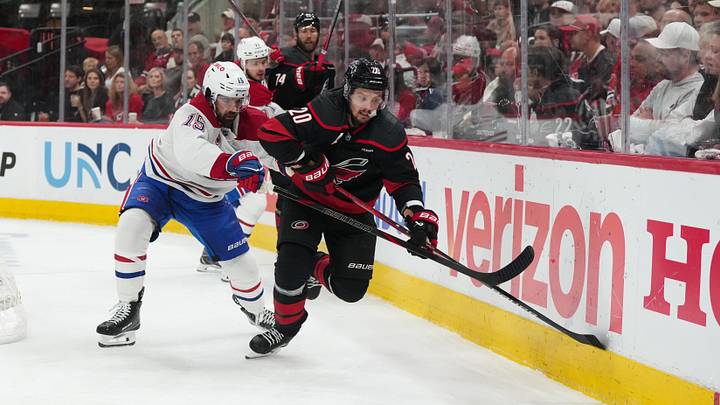 May 23, 2026; Raleigh, North Carolina, USA; Carolina Hurricanes center Sebastian Aho (20) chases the puck as Montréal Canadiens center Alex Newhook (15) defends during the second period in game two of the Eastern Conferene Final of the 2026 Stanley Cup Playoffs at Lenovo Center. Mandatory Credit: James Guillory-Imagn Images