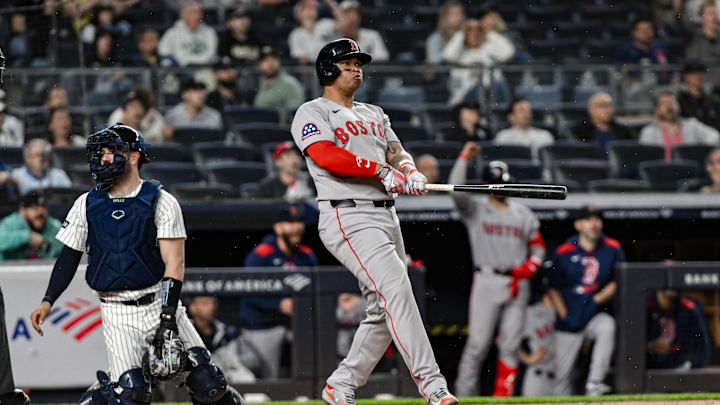 Jun 8, 2025; Bronx, New York, USA; Boston Red Sox designated hitter Rafael Devers (11) reacts after hitting a solo home run against the New York Yankees during the ninth inning at Yankee Stadium. Mandatory Credit: John Jones-Imagn Images
