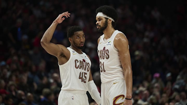 Feb 1, 2026; Portland, Oregon, USA; Cleveland Cavaliers guard Donovan Mitchell (45) talks to center Jarrett Allen (31) during the second half against the Portland Trail Blazers at Moda Center. 