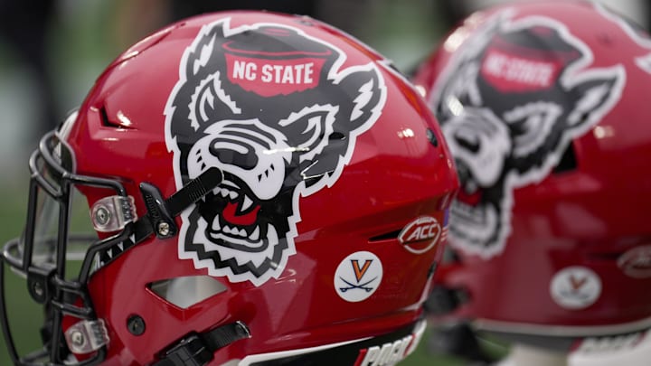 Dec 30, 2022; Charlotte, NC, USA; North Carolina State Wolfpack helmets during the first half against the Maryland Terrapins in the 2022 Duke's Mayo Bowl at Bank of America Stadium. Mandatory Credit: Jim Dedmon-Imagn Images Dec 30, 2022; Charlotte, NC, USA; North Carolina State Wolfpack helmets during the first half against the Maryland Terrapins in the 2022 Duke's Mayo Bowl at Bank of America Stadium. Mandatory Credit: Jim Dedmon-Imagn Images