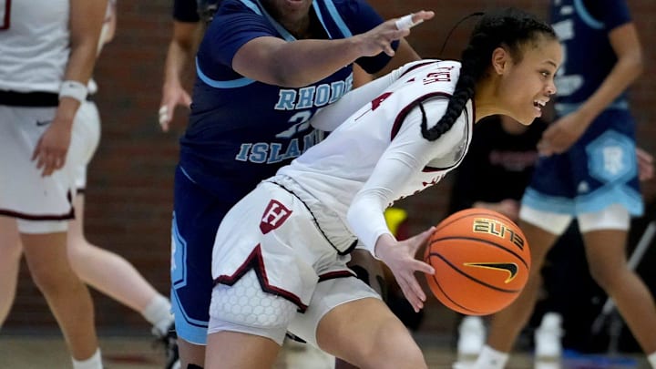 Sayawni Lassiter of the Rams reaches around Harmoni Turner going for the ball durning 2nd half action.