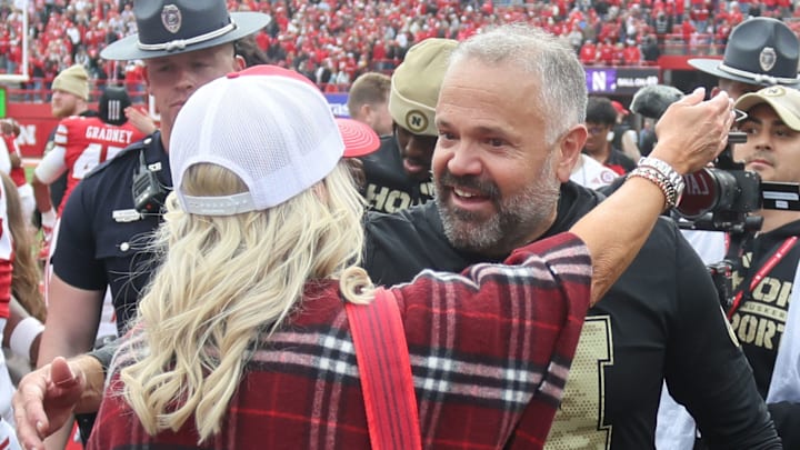 Matt Rhule hugs his wife, Julie, after beating Northwestern. Matt Rhule hugs his wife, Julie, after beating Northwestern.