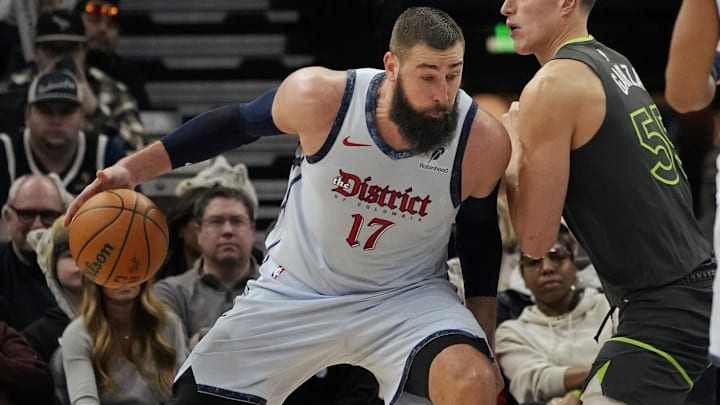 Feb 1, 2025; Minneapolis, Minnesota, USA; Washington Wizards center Jonas Valanciunas (17) works against Minnesota Timberwolves forward Luka Garza (55) in the third quarter at Target Center. Mandatory Credit: Bruce Kluckhohn-Imagn Images