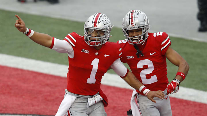 Ohio State Buckeyes quarterback Justin Fields celebrates his touchdown run with wide receiver Chris Olave.