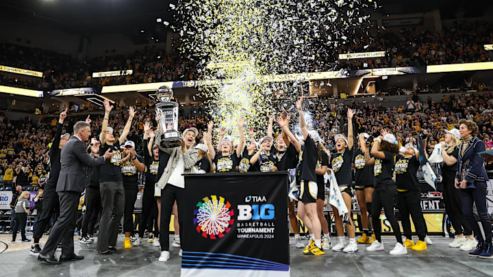 The Iowa Hawkeyes celebrate with the trophy after defeating the Nebraska Cornhuskers in the Big Ten Conference Tournament Championship at Target Center.  