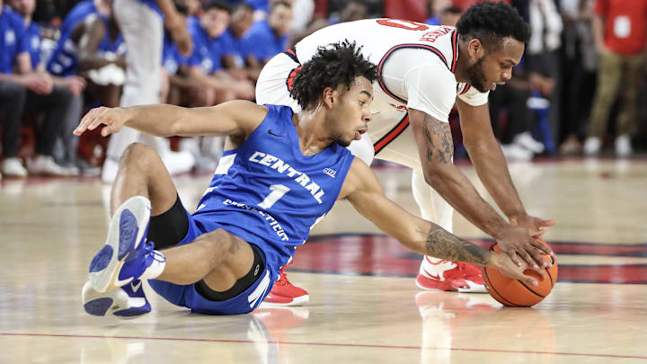 Nov 15, 2022; Queens, New York, USA;  St. John's Red Storm guard Posh Alexander (0) and Central Connecticut State Blue Devils guard Jay Rodgers (1) fight for a loose ball in the first half at Carnesecca Arena. Mandatory Credit: Wendell Cruz-Imagn Images