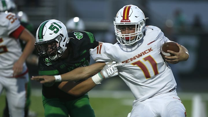 Badin tries to bring down Fenwick quarterback as Badin defeated Fenwick 41-13 in high school football Oct. 3, 2025, in Hamilton, Ohio