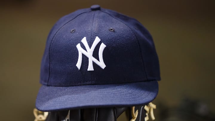 May 18, 2016; Phoenix, AZ, USA; Detailed view of a New York Yankees hat and baseball glove against the Arizona Diamondbacks at Chase Field. Mandatory Credit: Mark J. Rebilas-Imagn Images