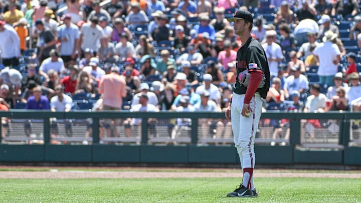 Jun 19, 2023; Omaha, NE, USA;  Stanford Cardinal starting pitcher Quinn Mathews (26) watches his replacement come in from the bullpen against the Tennessee Volunteers in the fifth inning at Charles Schwab Field Omaha. Mandatory Credit: Steven Branscombe-Imagn Images