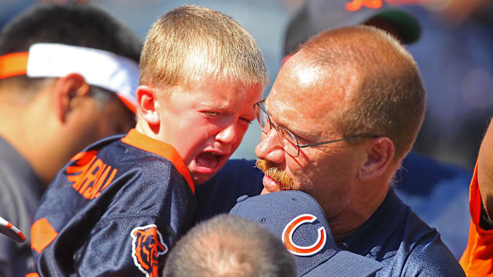 Sep 7, 2014; Chicago, IL, USA; A young fan reacts to falling onto the field after a game between the Chicago Bears and the Buffalo Bills at Soldier Field. Buffalo won 23-20 in overtime. Mandatory Credit: Dennis Wierzbicki-Imagn Images