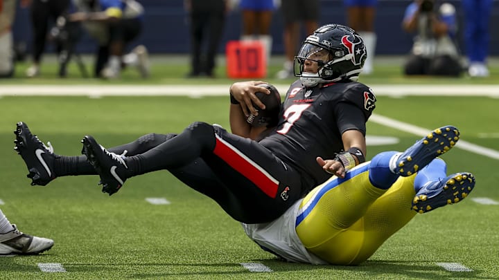 Sep 7, 2025; Inglewood, California, USA; Los Angeles Rams linebacker Byron Young (0) sacks Houston Texans quarterback C.J. Stroud (7) during the second quarter at SoFi Stadium. Mandatory Credit: Kiyoshi Mio-Imagn Images