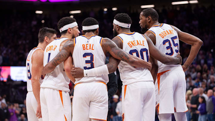 Apr 12, 2024; Sacramento, California, USA; Phoenix Suns guard Grayson Allen (8) and guard Devin Booker (1) and guard Bradley Beal (3) and forward Royce O'Neale (00) and forward Kevin Durant (35) huddle up before the final seconds of the fourth quarter at Golden 1 Center. Mandatory Credit: Ed Szczepanski-Imagn Images