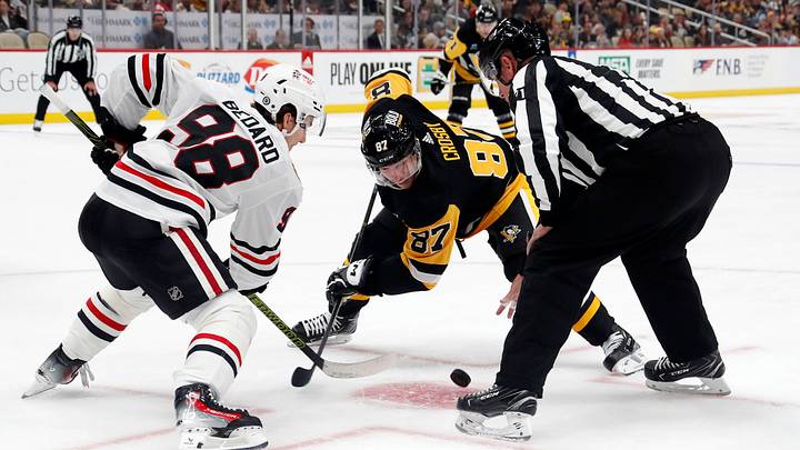 Oct 10, 2023; Pittsburgh, Pennsylvania, USA; Chicago Blackhawks center Connor Bedard (98) and Pittsburgh Penguins center Sidney Crosby (87) take a face-off during the third period at the PPG Paints Arena. Chicago won 4-2.  Mandatory Credit: Charles LeClaire-USA TODAY Sports