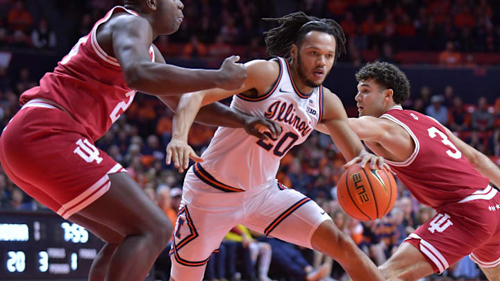 Illinois Fighting Illini forward Ty Rodgers (20) drives the ball between Indiana Hoosiers forward Payton Sparks (24) and guard Anthony Leal (3) during the first half at State Farm Center.
