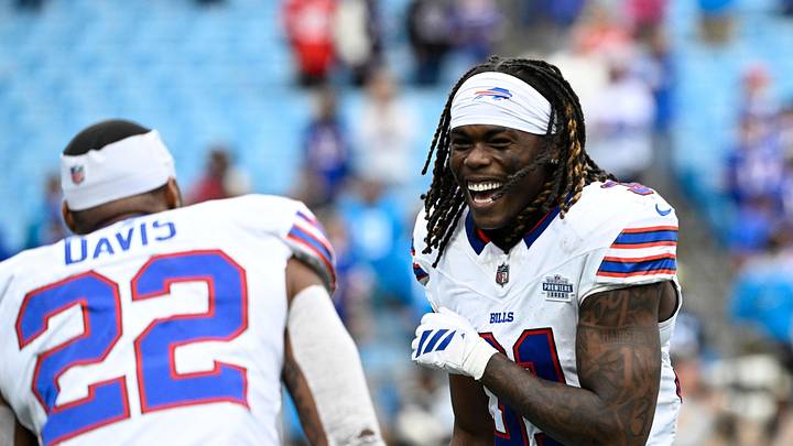 Buffalo Bills running back Ray Davis (22) celebrates with cornerback Maxwell Hairston (31) after a game against the Carolina Panthers at Bank of America Stadium.