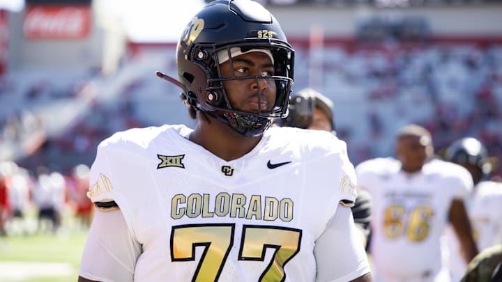 Oct 19, 2024; Tucson, Arizona, USA; Colorado Buffalos offensive tackle Jordan Seaton (77) against the Arizona Wildcats at Arizona Stadium. Mandatory Credit: Mark J. Rebilas-Imagn Images