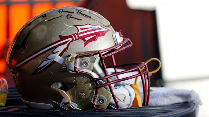 Nov 25, 2017; Gainesville, FL, USA; Florida State Seminoles helmet lays on the field against the Florida Gators during the second half at Ben Hill Griffin Stadium. Mandatory Credit: Kim Klement-Imagn Images