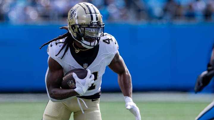 Nov 3, 2024; Charlotte, North Carolina, USA; New Orleans Saints running back Alvin Kamara (41) runs the ball against the Carolina Panthers during the first quarter at Bank of America Stadium. Mandatory Credit: Scott Kinser-Imagn Images