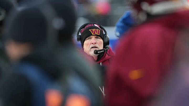 Dec 14, 2025; East Rutherford, New Jersey, USA;  Washington Commanders head coach Dan Quinn looks on during the fourth quarter against the New York Giants at MetLife Stadium. Mandatory Credit: Robert Deutsch-Imagn Images