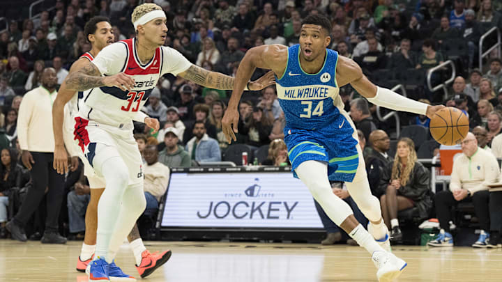 Nov 24, 2023; Milwaukee, Wisconsin, USA; Milwaukee Bucks forward Giannis Antetokounmpo (34) drives for the basket around Washington Wizards forward Kyle Kuzma (33) during the third quarter at Fiserv Forum. Mandatory Credit: Jeff Hanisch-Imagn Images Nov 24, 2023; Milwaukee, Wisconsin, USA; Milwaukee Bucks forward Giannis Antetokounmpo (34) drives for the basket around Washington Wizards forward Kyle Kuzma (33) during the third quarter at Fiserv Forum. Mandatory Credit: Jeff Hanisch-Imagn Images
