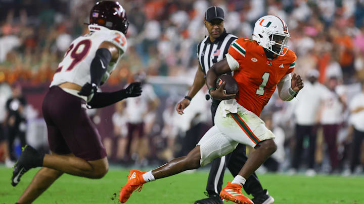 Sep 27, 2024; Miami Gardens, Florida, USA; Miami Hurricanes quarterback Cam Ward (1) runs with the football against the Virginia Tech Hokies during the fourth quarter at Hard Rock Stadium. Mandatory Credit: Sam Navarro-Imagn Images Sep 27, 2024; Miami Gardens, Florida, USA; Miami Hurricanes quarterback Cam Ward (1) runs with the football against the Virginia Tech Hokies during the fourth quarter at Hard Rock Stadium. Mandatory Credit: Sam Navarro-Imagn Images