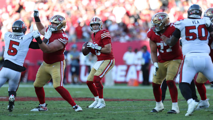 Oct 12, 2025; Tampa, Florida, USA; San Francisco 49ers quarterback Mac Jones (10) throws downfield during the first half against the Tampa Bay Buccaneers at Raymond James Stadium. Mandatory Credit: Nathan Ray Seebeck-Imagn Images
