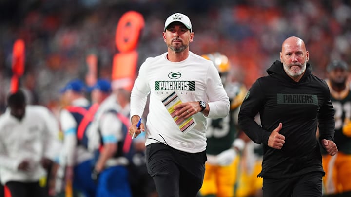 Aug 18, 2024; Denver, Colorado, USA; Green Bay Packers head coach Matt LaFleur leaves the field in the first half against the Denver Broncos at Empower Field at Mile High. Mandatory Credit: Ron Chenoy-USA TODAY Sports