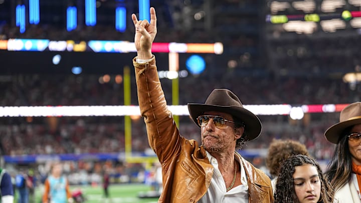 Actor Matthew McConaughey walks the field ahead of the College Football Playoff semifinal game between the Texas Longhorns and Ohio State in the Cotton Bowl at AT&T Stadium on Friday, Jan. 10, 2024 in Arlington, Texas.