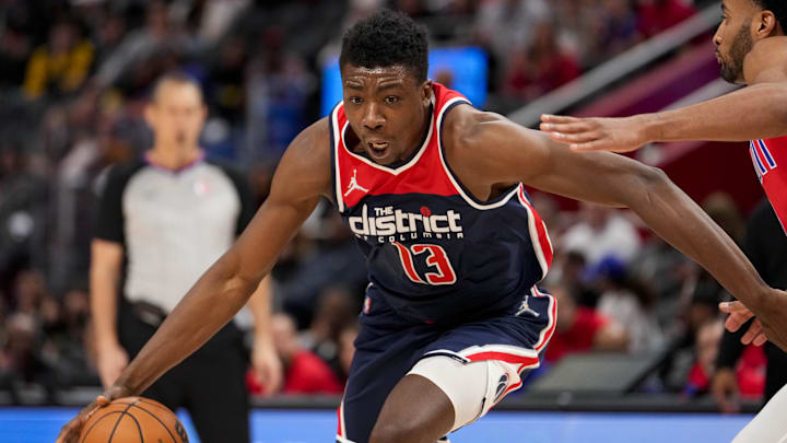 Mar 25, 2022; Detroit, Michigan, USA; Washington Wizards center Thomas Bryant (13) drives to the basket against Detroit Pistons forward Braxton Key (8) during the second quarter at Little Caesars Arena. Mandatory Credit: Raj Mehta-Imagn Images