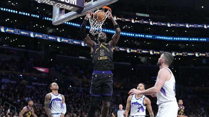 Nov 18, 2025; Los Angeles, California, USA: Los Angeles Lakers center Deandre Ayton (5) dunks the ball against the Utah Jazz in the second quarter at Crypto.com Arena. Mandatory Credit: Kirby Lee-Imagn Images