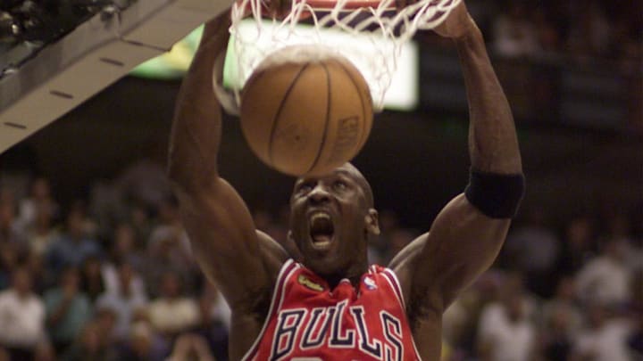 June 5, 1998; Salt Lake City, UT, USA; Chicago Bulls guard Michael Jordan dunks in game two of the 1998 NBA Finals against the Utah Jazz at the Delta Center.  Mandatory Credit: Robert Hanashiro-USA TODAY