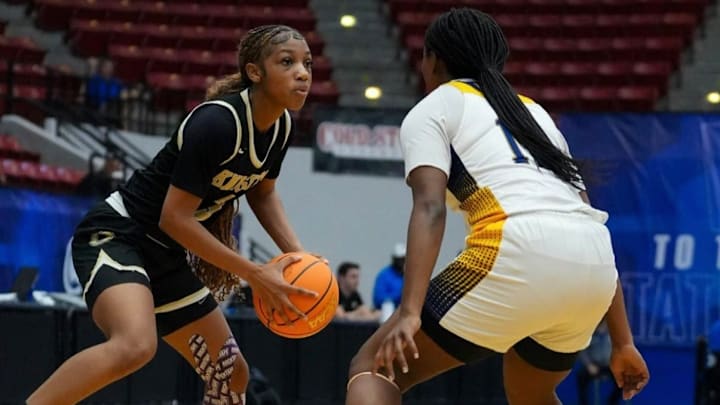 Ocoee senior guard Dakara Merthie (left) looks for an opening to the basket in an earlier game. She had 15 points, including two 3-pointers, and three rebounds, three assists and six steals to march the Knights past West Port, 65-19, for the Class 7A, District 3 title. Ocoee senior guard Dakara Merthie (left) looks for an opening to the basket in an earlier game. She had 15 points, including two 3-pointers, and three rebounds, three assists and six steals to march the Knights past West Port, 65-19, for the Class 7A, District 3 title.