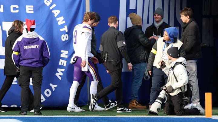 Dec 21, 2025; East Rutherford, New Jersey, USA; Minnesota Vikings quarterback J.J. McCarthy (9) is taken to the locker room after a hit against the New York Giants during the first half at MetLife Stadium.