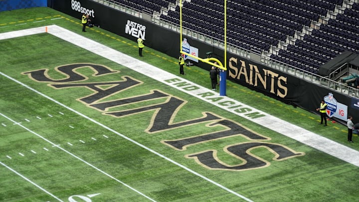 Oct 2, 2022; London, United Kingdom; The words \"End Racism\" and the New Orleans Saints logo in the end zone before an NFL International Series game at Tottenham Hotspur Stadium. Mandatory Credit: Kirby Lee-Imagn Images