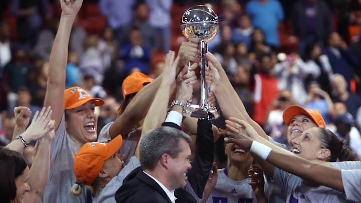 Sep 12, 2014; Chicago, IL, USA; Phoenix Mercury players celebrate after receiving the WNBA championship trophy after defeating the Chicago Sky in game three of the 2014 WNBA Finals at UIC Pavilion. Mandatory Credit: Jerry Lai-Imagn Images