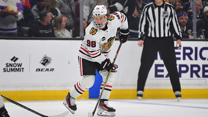 Apr 18, 2024; Los Angeles, California, USA; Chicago Blackhawks center Connor Bedard (98) controls the puck against the Los Angeles Kings during the first period at Crypto.com Arena. Mandatory Credit: Gary A. Vasquez-USA TODAY Sports