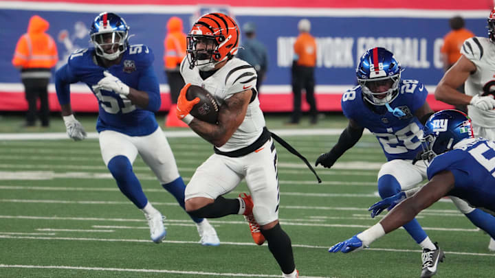 Oct 13, 2024; East Rutherford, New Jersey, USA;  Cincinnati Bengals running back Chase Brown (30) runs for a touchdown against the New York Giants inside of two minutes left in the game at MetLife Stadium. Mandatory Credit: Robert Deutsch-Imagn Images