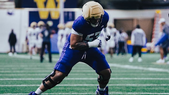 Paki Finau comes out of a stance in spring ball. Paki Finau comes out of a stance in spring ball.