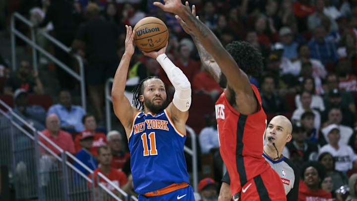 Nov 4, 2024; Houston, Texas, USA; New York Knicks guard Jalen Brunson (11) shoots the ball as Houston Rockets forward Tari Eason (17) defends during the third quarter at Toyota Center. Mandatory Credit: Troy Taormina-Imagn Images