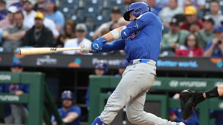 Apr 29, 2025; Pittsburgh, Pennsylvania, USA;  Chicago Cubs catcher Carson Kelly (15) hits a two-run home run against the Pittsburgh Pirates during the fourth inning at PNC Park.