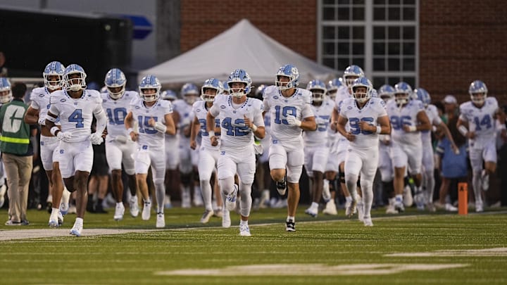 Sep 6, 2025; Charlotte, North Carolina, USA; North Carolina Tar Heels take the field during the first half against the Charlotte 49ers at Jerry Richardson Stadium. Mandatory Credit: Jim Dedmon-Imagn Images