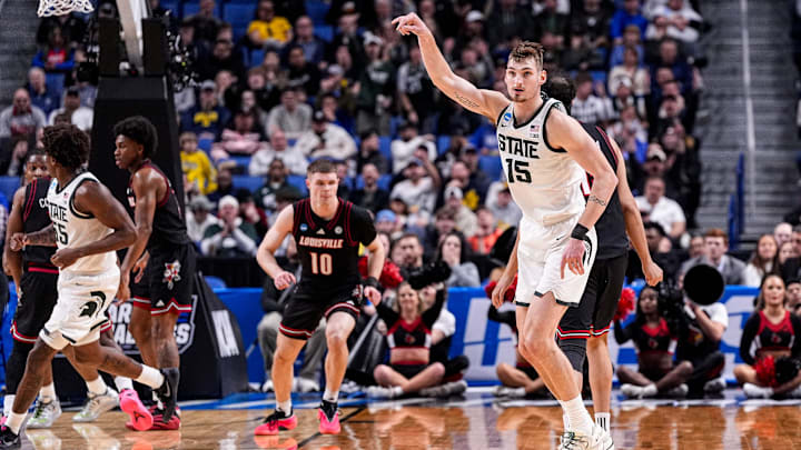 Michigan State center Carson Cooper (15) celebrates a jump shot against Louisville during the first half of NCAA Tournament Second Round at KeyBank Center in Buffalo on Saturday, March 21, 2026.