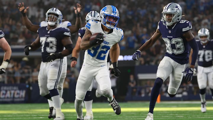 Oct 13, 2024; Arlington, Texas, USA; Detroit Lions safety Brian Branch (32) returns an interception during the second half against the Dallas Cowboys  at AT&T Stadium. Mandatory Credit: Kevin Jairaj-Imagn Images