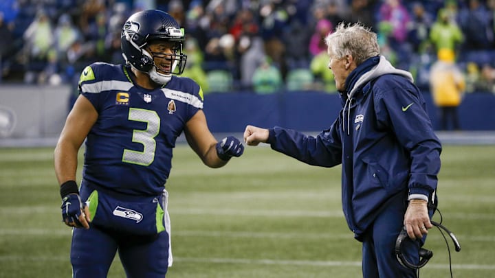 Jan 2, 2022; Seattle, Washington, USA; Seattle Seahawks quarterback Russell Wilson (3) bumps fists with head coach Pete Carroll during the fourth quarter two-minute warning against the Detroit Lions at Lumen Field. Mandatory Credit: Joe Nicholson-Imagn Images Jan 2, 2022; Seattle, Washington, USA; Seattle Seahawks quarterback Russell Wilson (3) bumps fists with head coach Pete Carroll during the fourth quarter two-minute warning against the Detroit Lions at Lumen Field. Mandatory Credit: Joe Nicholson-Imagn Images