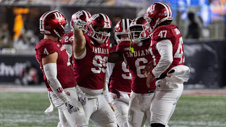 Indiana Hoosiers defensive lineman James Carpenter (99) celebrates his run for a first down with teammates  in the second half against the Purdue Boilermakers at Memorial Stadium.