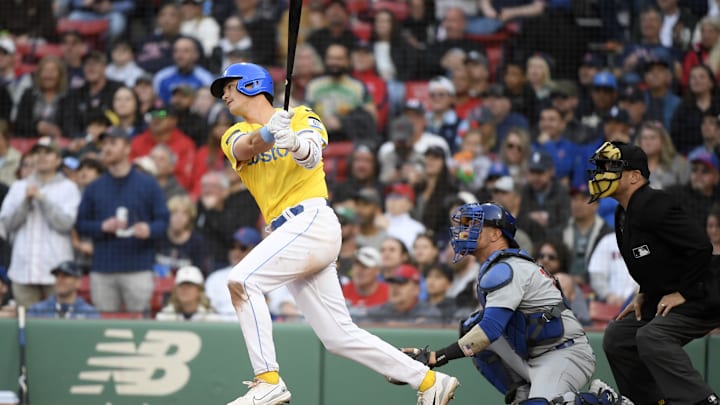 Apr 27, 2024; Boston, Massachusetts, USA;  Boston Red Sox first baseman Bobby Dalbec (29) hits an RBI double during the eighth inning against the Chicago Cubs at Fenway Park. Mandatory Credit: Bob DeChiara-Imagn Images